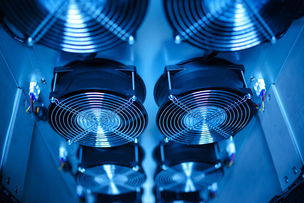 services-03 Close-up of cooling fans in a server room, showcasing technology and efficiency.